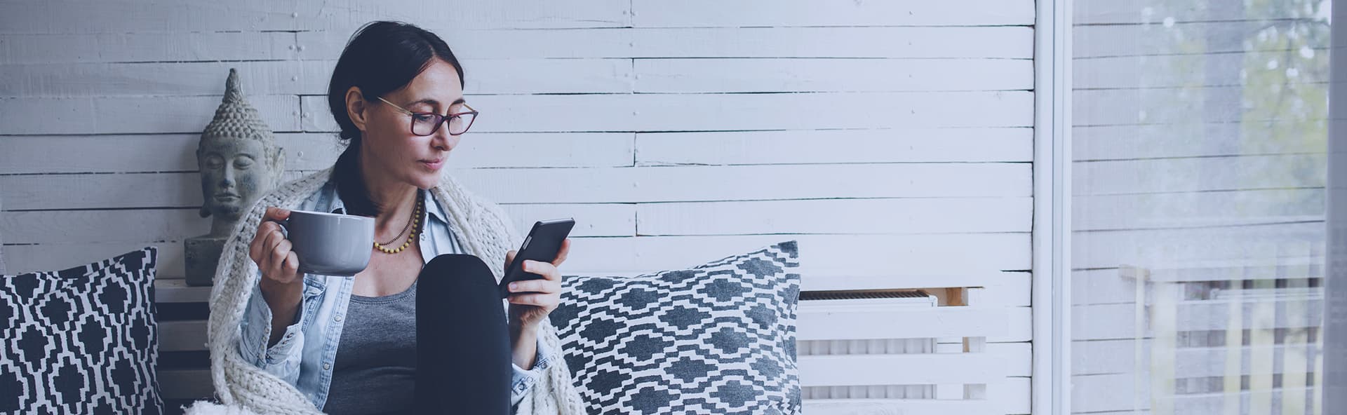 woman looking at smartphone