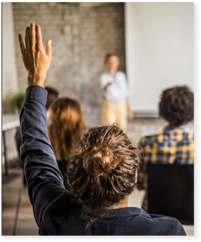 student raising hand